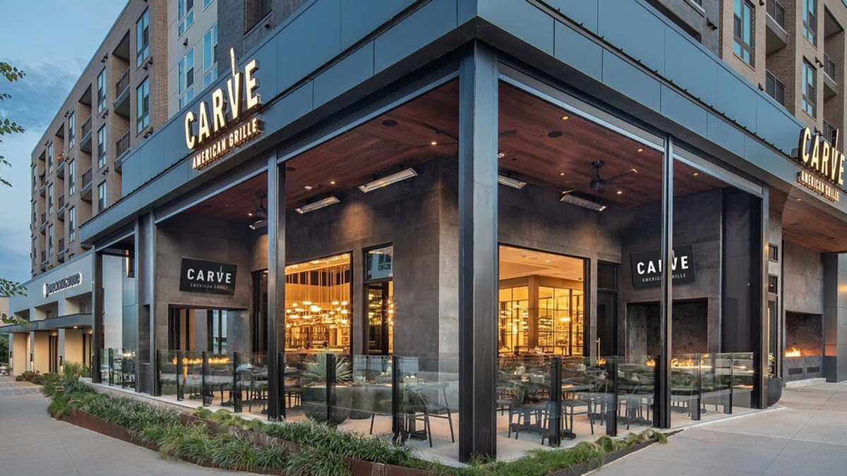 retractable glass railing at carve american grille