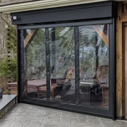 vinyl retractable patio screens providing wind and weather protection on an enclosed outdoor patio